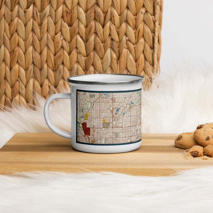 Left View Custom Lawrence Indiana Map Enamel Mug in Woodblock on Table Top