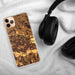Custom Lawrence Kansas Map Phone Case in Ember on Table with Black Headphones