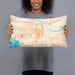 Person holding 20x12 Custom Lawrence Kansas Map Throw Pillow in Watercolor