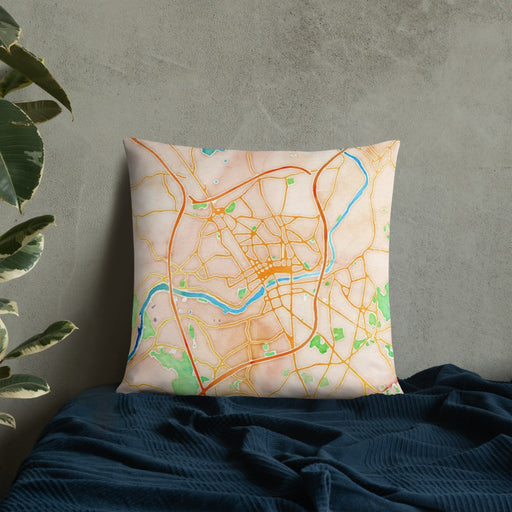 Custom Lawrence Massachusetts Map Throw Pillow in Watercolor on Bedding Against Wall