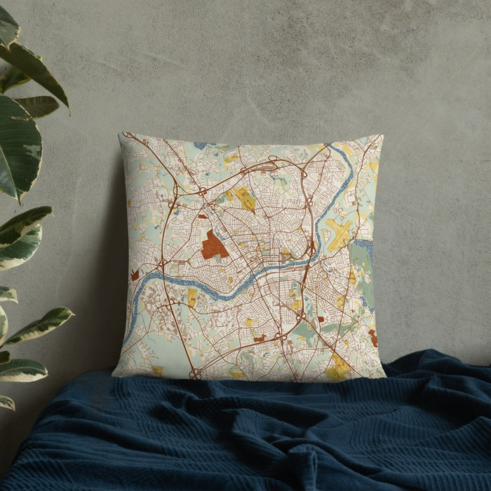 Custom Lawrence Massachusetts Map Throw Pillow in Woodblock on Bedding Against Wall