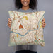 Person holding 18x18 Custom Lawrence Massachusetts Map Throw Pillow in Woodblock