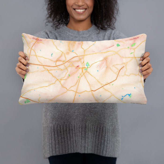 Person holding 20x12 Custom Lawrenceville Georgia Map Throw Pillow in Watercolor