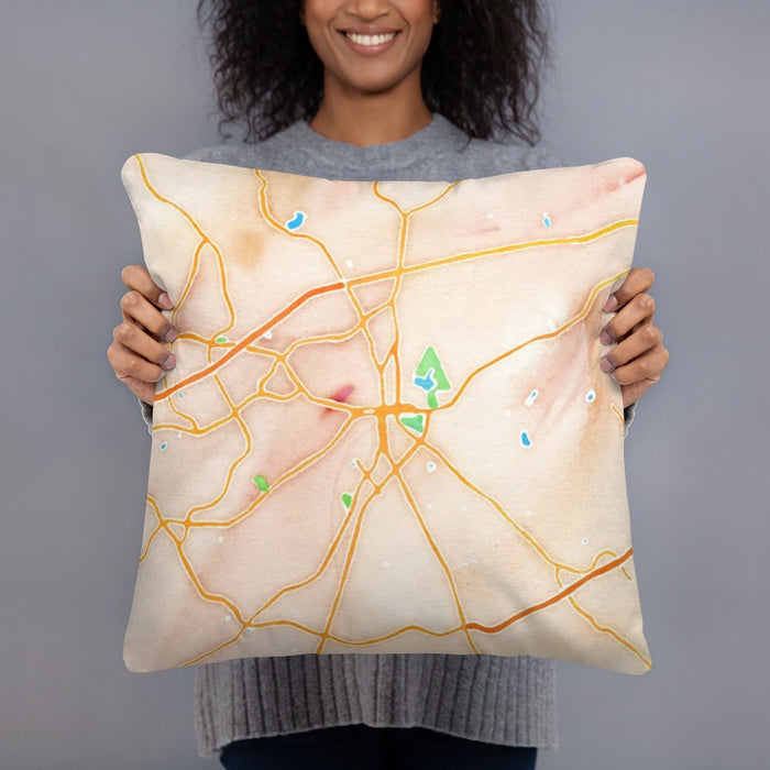 Person holding 18x18 Custom Lawrenceville Georgia Map Throw Pillow in Watercolor