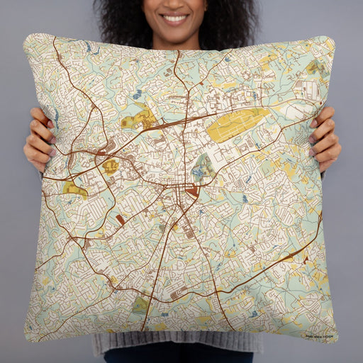 Person holding 22x22 Custom Lawrenceville Georgia Map Throw Pillow in Woodblock