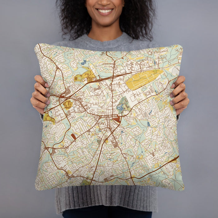 Person holding 18x18 Custom Lawrenceville Georgia Map Throw Pillow in Woodblock