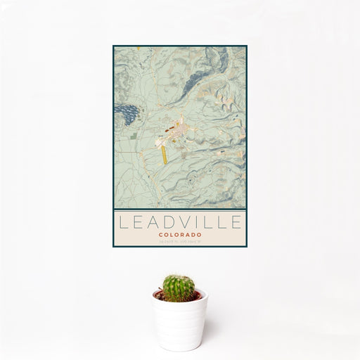 12x18 Leadville Colorado Map Print Portrait Orientation in Woodblock Style With Small Cactus Plant in White Planter