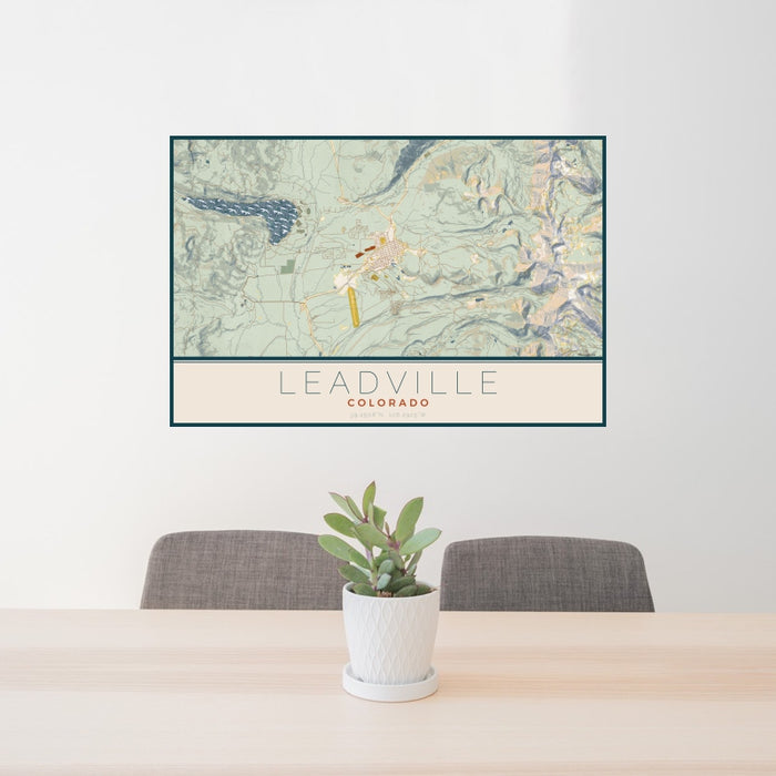 24x36 Leadville Colorado Map Print Landscape Orientation in Woodblock Style Behind 2 Chairs Table and Potted Plant