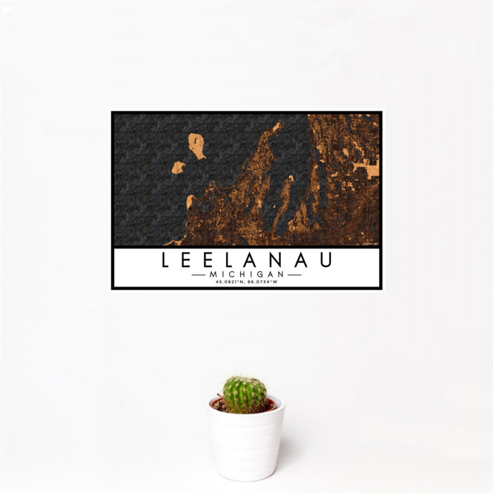 12x18 Leelanau Michigan Map Print Landscape Orientation in Ember Style With Small Cactus Plant in White Planter