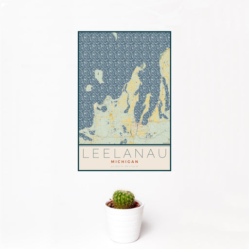 12x18 Leelanau Michigan Map Print Portrait Orientation in Woodblock Style With Small Cactus Plant in White Planter