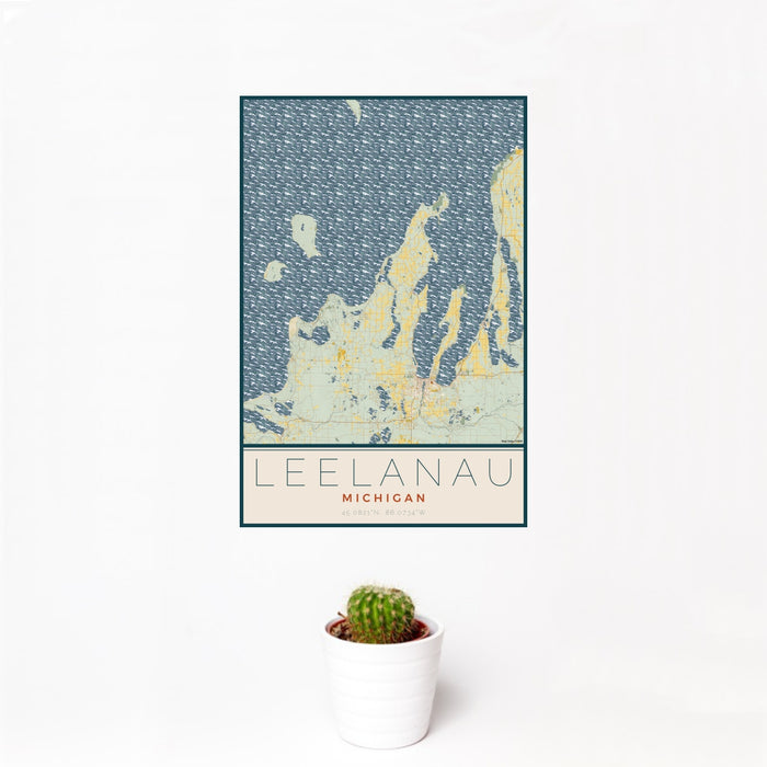 12x18 Leelanau Michigan Map Print Portrait Orientation in Woodblock Style With Small Cactus Plant in White Planter