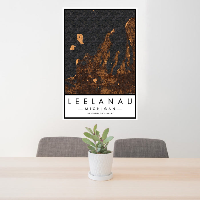 24x36 Leelanau Michigan Map Print Portrait Orientation in Ember Style Behind 2 Chairs Table and Potted Plant