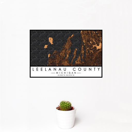12x18 Leelanau County Michigan Map Print Landscape Orientation in Ember Style With Small Cactus Plant in White Planter