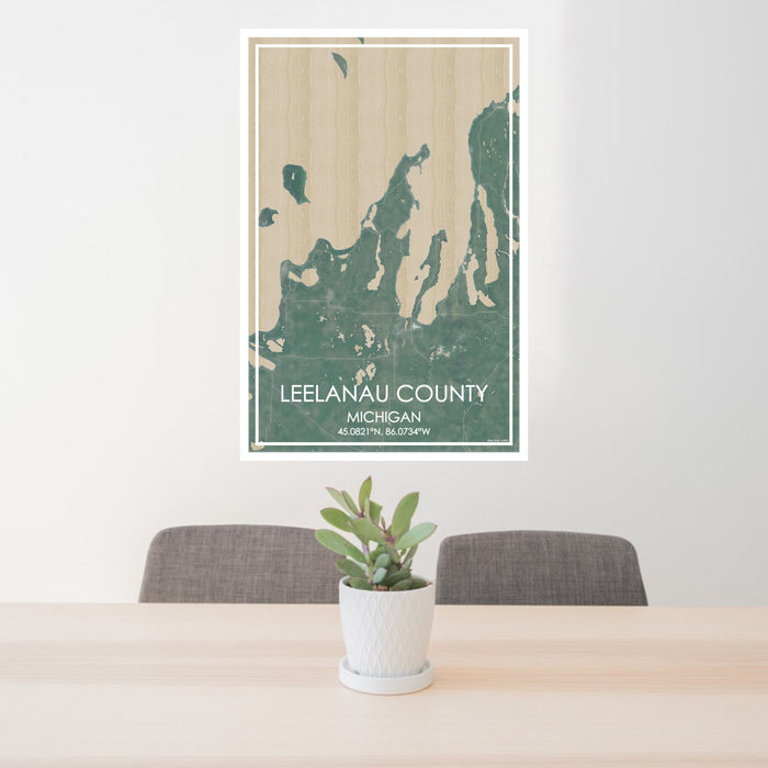 24x36 Leelanau County Michigan Map Print Portrait Orientation in Afternoon Style Behind 2 Chairs Table and Potted Plant