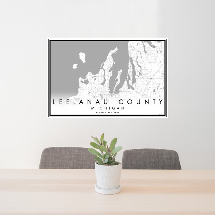 24x36 Leelanau County Michigan Map Print Lanscape Orientation in Classic Style Behind 2 Chairs Table and Potted Plant