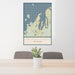 24x36 Leelanau County Michigan Map Print Portrait Orientation in Woodblock Style Behind 2 Chairs Table and Potted Plant
