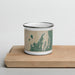 Front View Custom Leelanau County Michigan Map Enamel Mug in Afternoon on Cutting Board