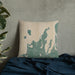Custom Leelanau County Michigan Map Throw Pillow in Afternoon on Bedding Against Wall