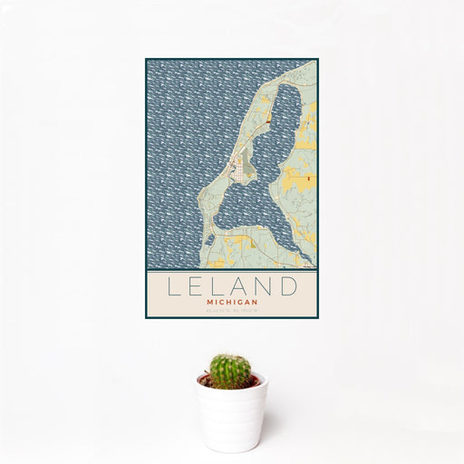 12x18 Leland Michigan Map Print Portrait Orientation in Woodblock Style With Small Cactus Plant in White Planter