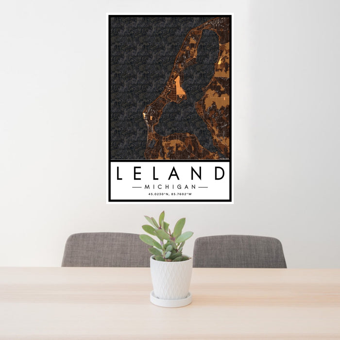 24x36 Leland Michigan Map Print Portrait Orientation in Ember Style Behind 2 Chairs Table and Potted Plant