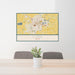24x36 Lima Ohio Map Print Lanscape Orientation in Woodblock Style Behind 2 Chairs Table and Potted Plant