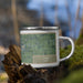 Right View Custom Lima Ohio Map Enamel Mug in Afternoon on Grass With Trees in Background