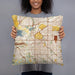 Person holding 18x18 Custom Lincoln Nebraska Map Throw Pillow in Woodblock