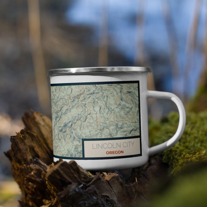 Right View Custom Lincoln City Oregon Map Enamel Mug in Woodblock on Grass With Trees in Background