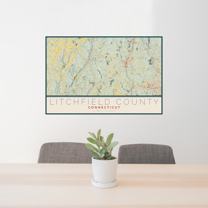 24x36 Litchfield County Connecticut Map Print Lanscape Orientation in Woodblock Style Behind 2 Chairs Table and Potted Plant
