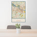 24x36 Little Rock Arkansas Map Print Portrait Orientation in Woodblock Style Behind 2 Chairs Table and Potted Plant