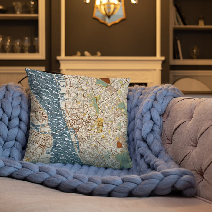 Custom Liverpool England Map Throw Pillow in Woodblock on Cream Colored Couch