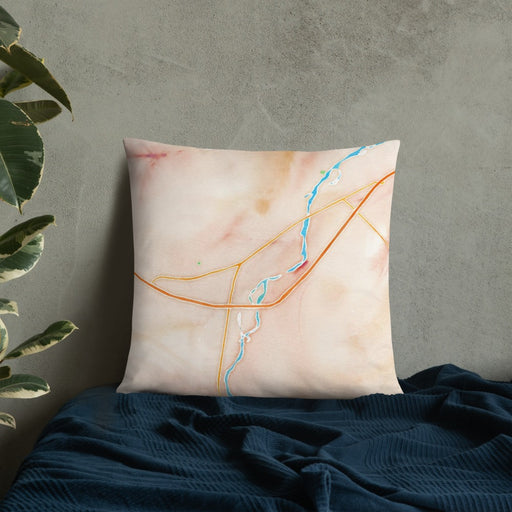Custom Livingston Montana Map Throw Pillow in Watercolor on Bedding Against Wall