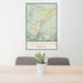24x36 Livingston Montana Map Print Portrait Orientation in Woodblock Style Behind 2 Chairs Table and Potted Plant