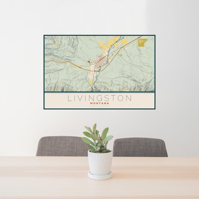 24x36 Livingston Montana Map Print Landscape Orientation in Woodblock Style Behind 2 Chairs Table and Potted Plant