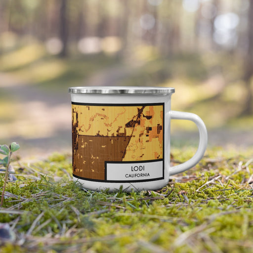 Right View Custom Lodi California Map Enamel Mug in Ember on Grass With Trees in Background