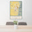 24x36 Logan Utah Map Print Portrait Orientation in Woodblock Style Behind 2 Chairs Table and Potted Plant