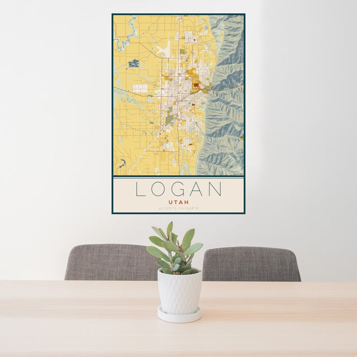 24x36 Logan Utah Map Print Portrait Orientation in Woodblock Style Behind 2 Chairs Table and Potted Plant