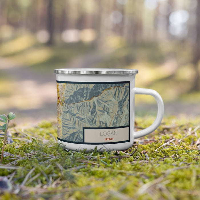 Right View Custom Logan Utah Map Enamel Mug in Woodblock on Grass With Trees in Background