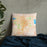 Custom Longmont Colorado Map Throw Pillow in Watercolor on Bedding Against Wall