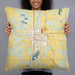 Person holding 22x22 Custom Long Prairie Minnesota Map Throw Pillow in Woodblock