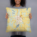 Person holding 18x18 Custom Long Prairie Minnesota Map Throw Pillow in Woodblock