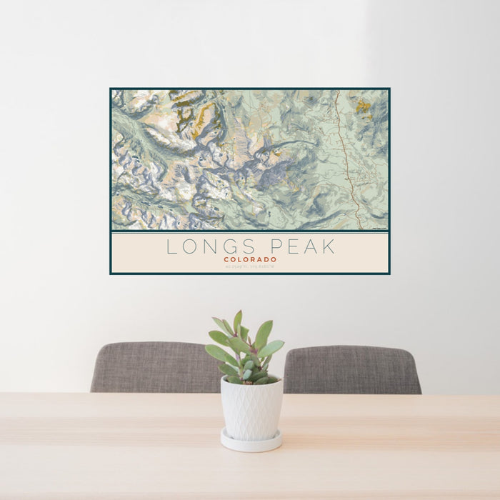 24x36 Longs Peak Colorado Map Print Lanscape Orientation in Woodblock Style Behind 2 Chairs Table and Potted Plant