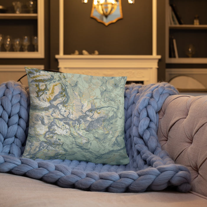 Custom Longs Peak Colorado Map Throw Pillow in Woodblock on Cream Colored Couch