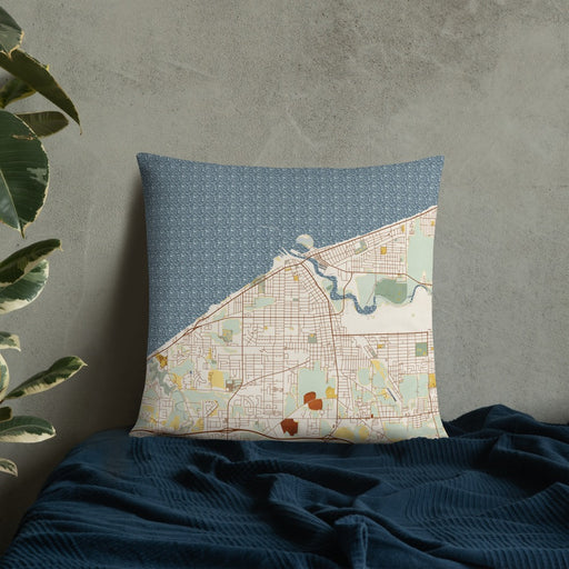 Custom Lorain Ohio Map Throw Pillow in Woodblock on Bedding Against Wall