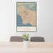24x36 Los Angeles California Map Print Portrait Orientation in Woodblock Style Behind 2 Chairs Table and Potted Plant