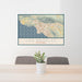 24x36 Los Angeles California Map Print Landscape Orientation in Woodblock Style Behind 2 Chairs Table and Potted Plant
