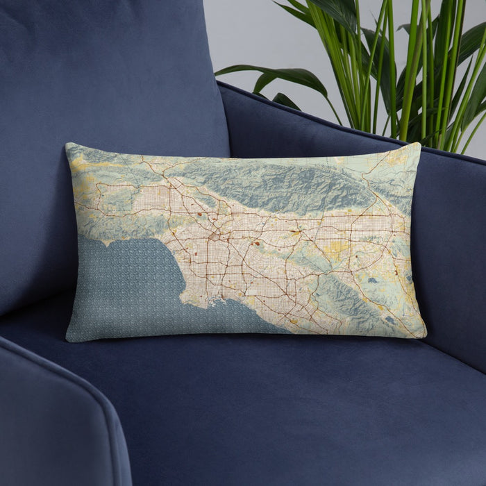 Custom Los Angeles California Map Throw Pillow in Woodblock on Blue Colored Chair