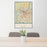 24x36 Louisville Kentucky Map Print Portrait Orientation in Woodblock Style Behind 2 Chairs Table and Potted Plant