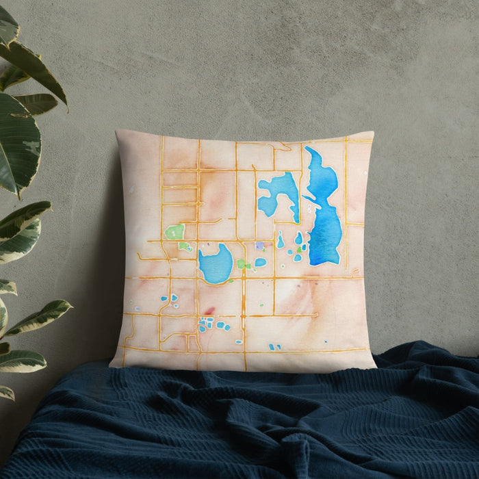 Custom Loveland Colorado Map Throw Pillow in Watercolor on Bedding Against Wall
