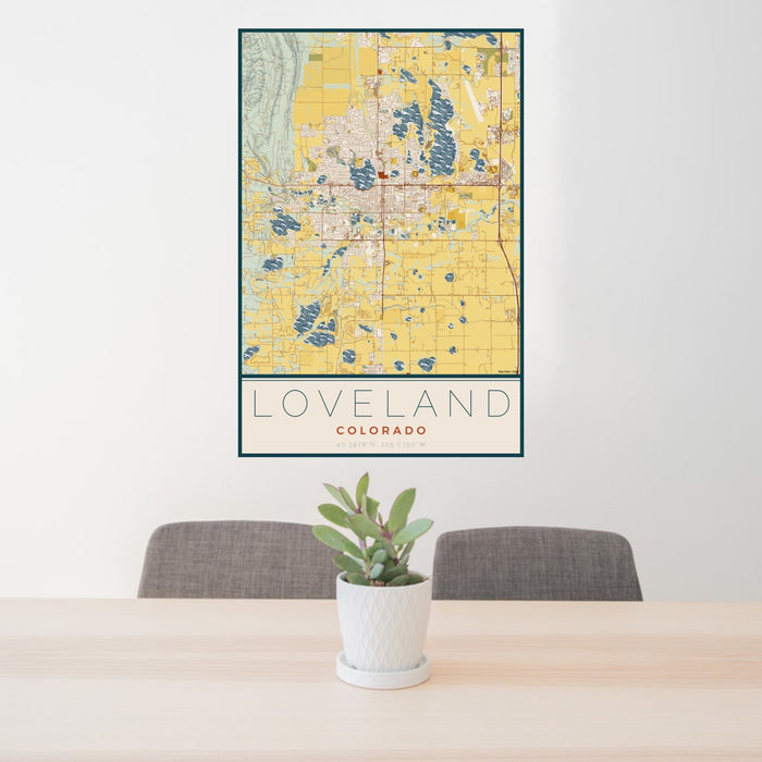 24x36 Loveland Colorado Map Print Portrait Orientation in Woodblock Style Behind 2 Chairs Table and Potted Plant